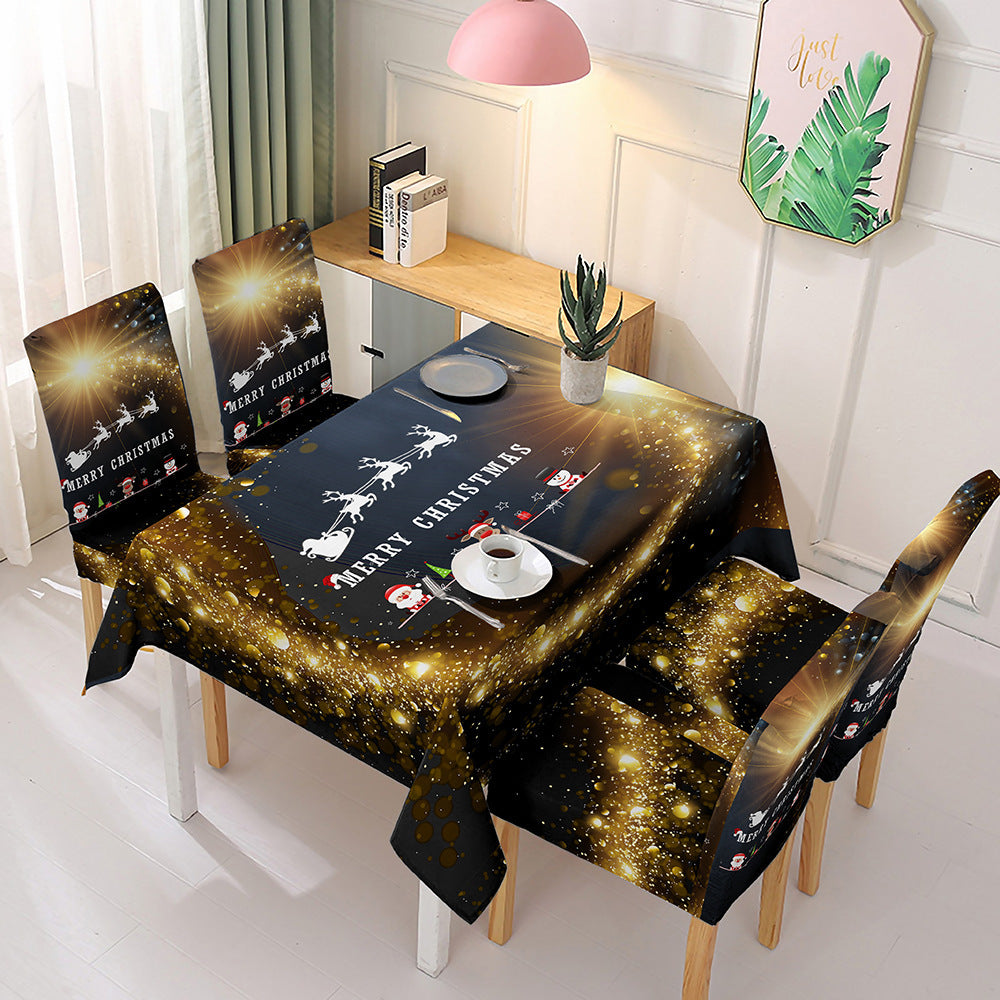 Christmas dining table decor featuring a festive tablecloth and matching chair covers with holiday designs