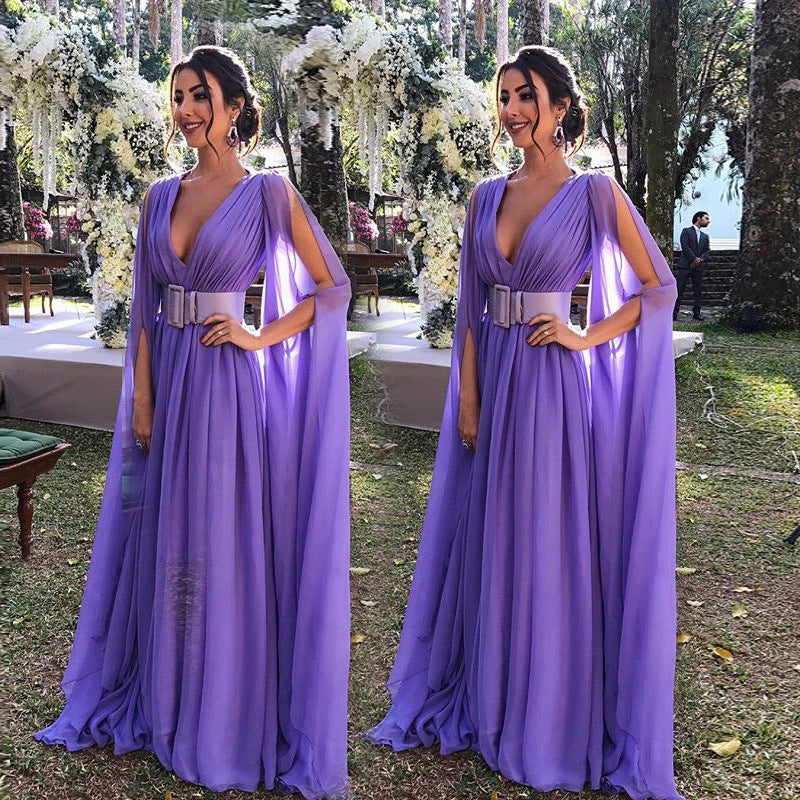 Elegant deep V waist dress for events in purple with flowing cape sleeves and a stylish belt