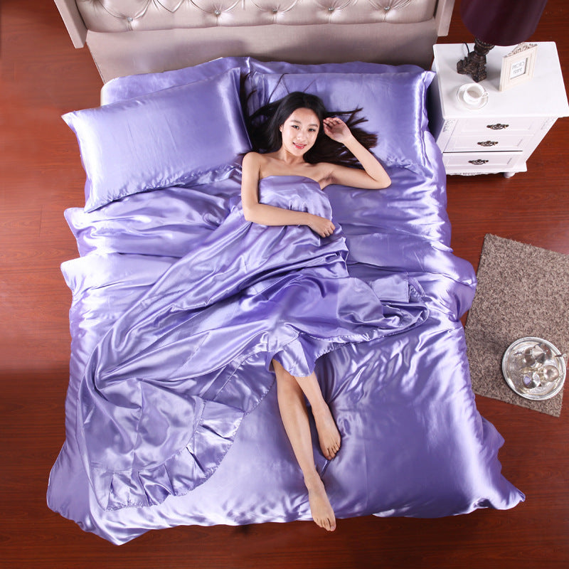 Silk four-piece bedding set in lavender with soft luxurious fabric and elegant design for a stylish bedroom