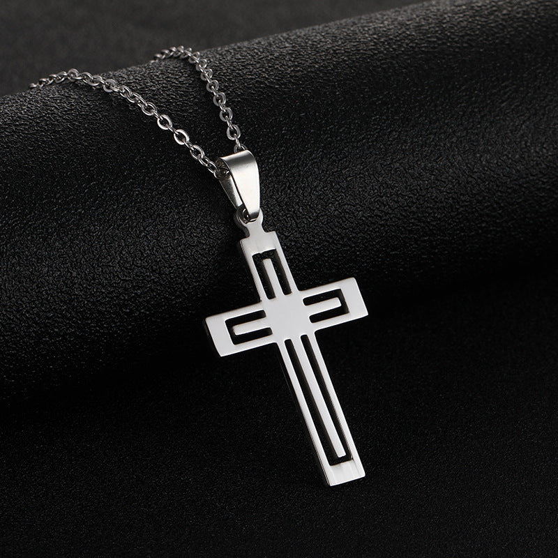 Stylish stainless steel cross necklace on a black background for daily wear and religious significance