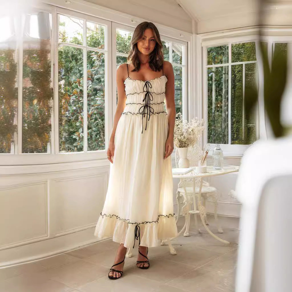 Elegant summer spaghetti strap dress with lace-up detail and ruffled hem for women