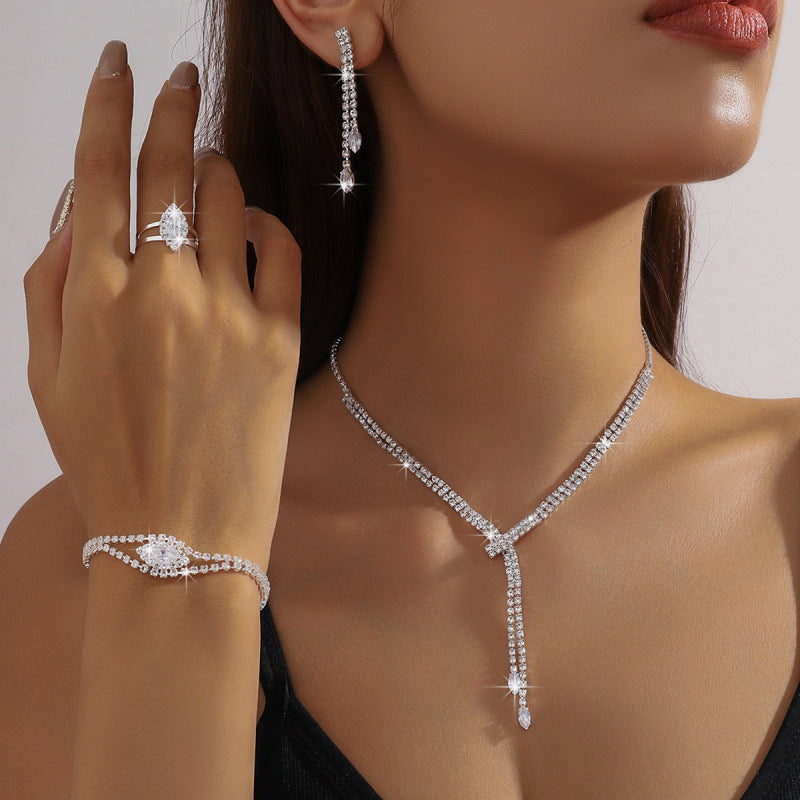 Elegant wedding zirconium jewelry set featuring necklace, earrings, bracelet, and rings for special occasions