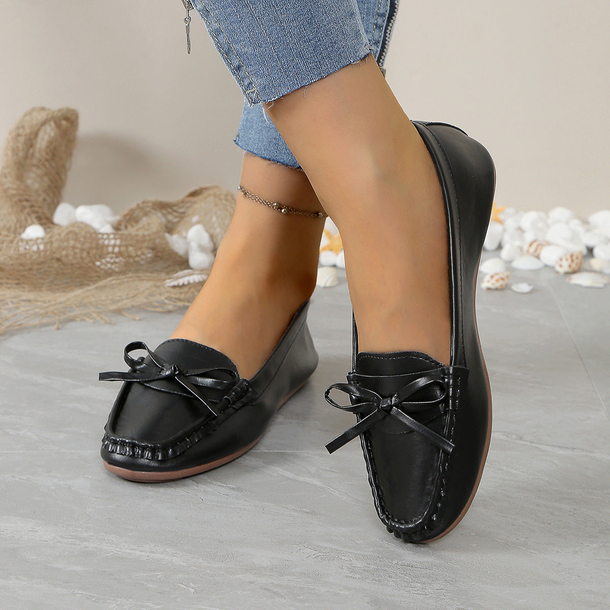 Stylish black comfortable loafers for women with bow detailing, perfect for casual outings