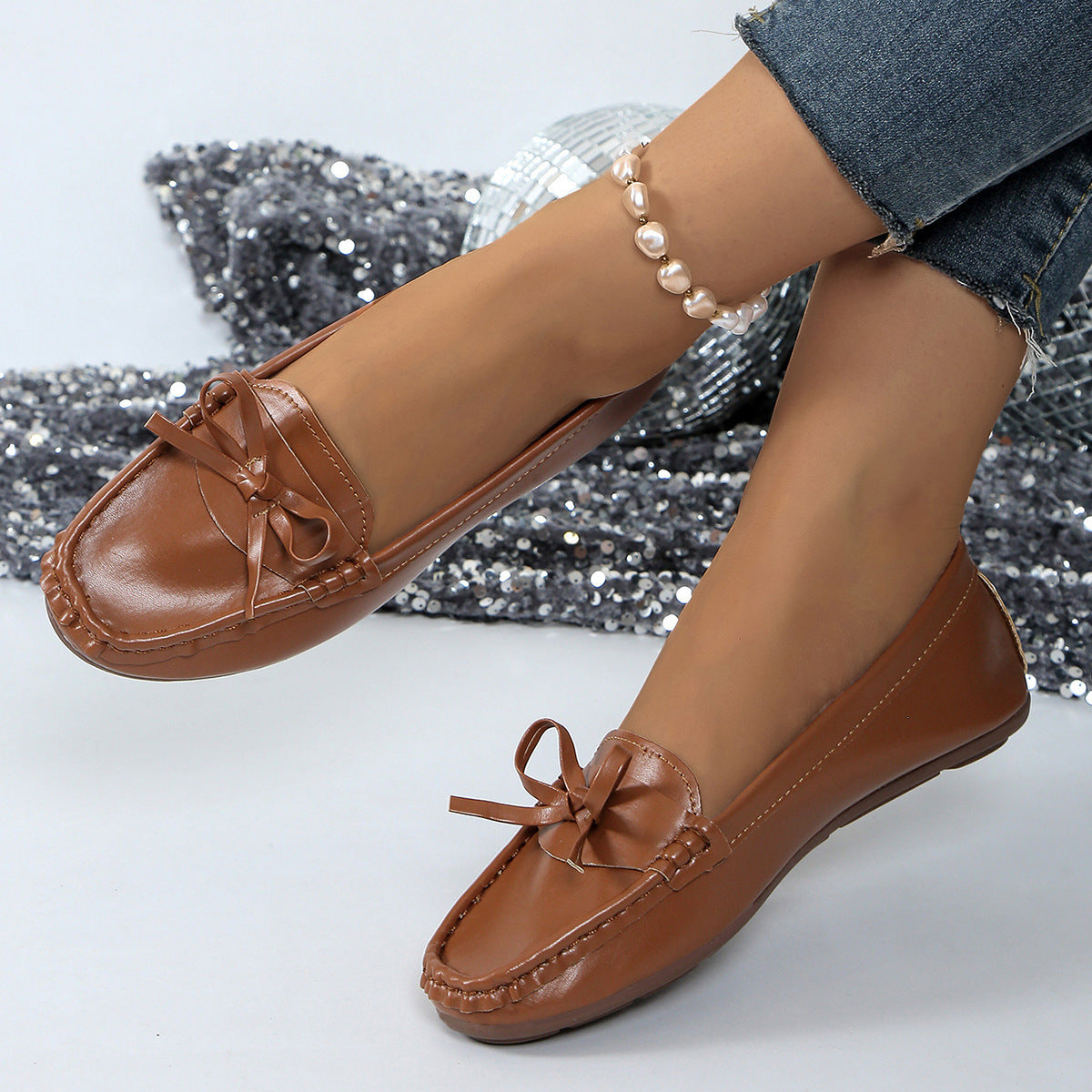 Brown comfortable loafers for women with a bow detail for stylish everyday wear