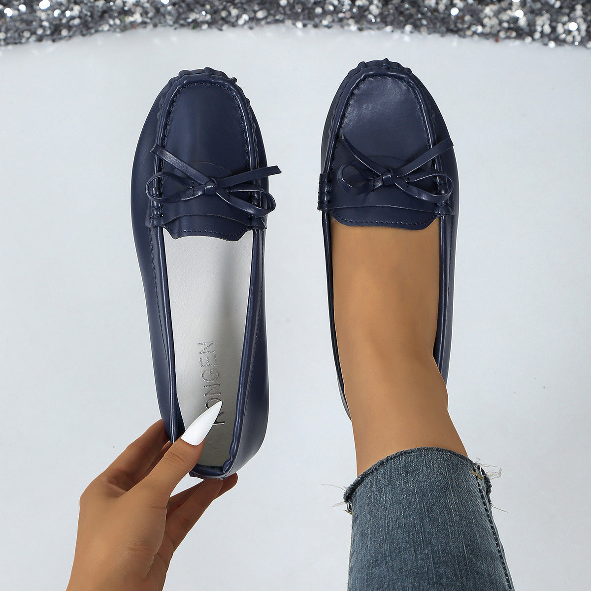 Stylish navy comfortable loafers for women with bow detail, perfect for everyday wear