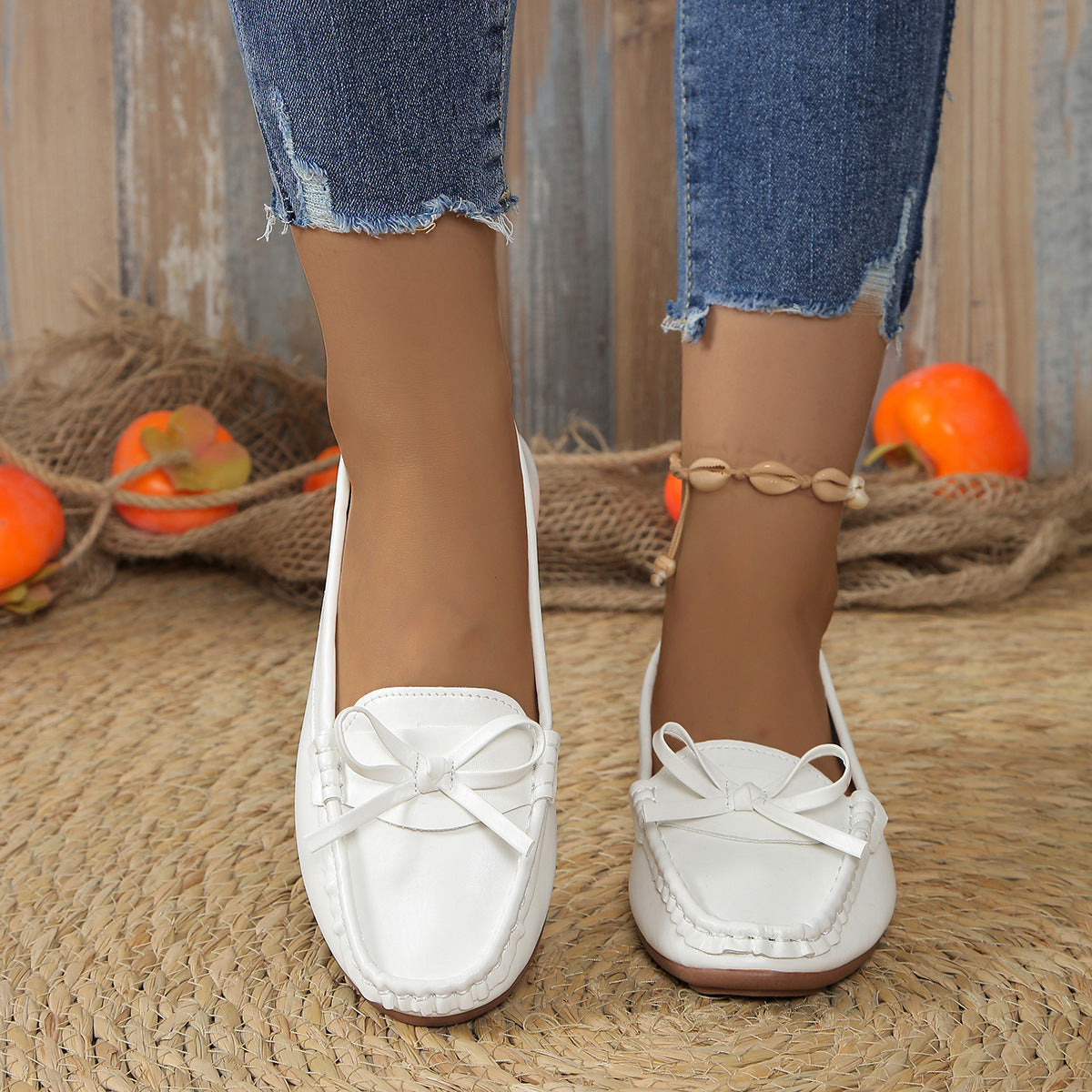 Stylish and comfortable loafers for women in white with bow detail, perfect for casual outings